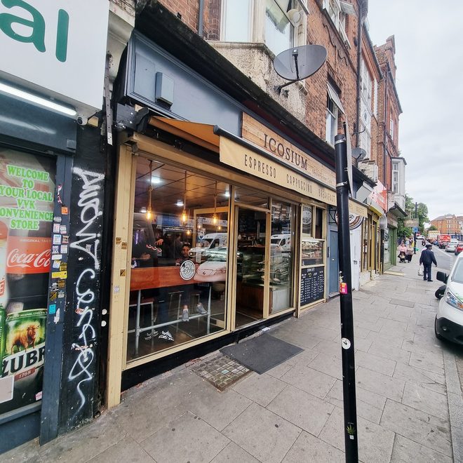 The shopfront and awning from the pavement