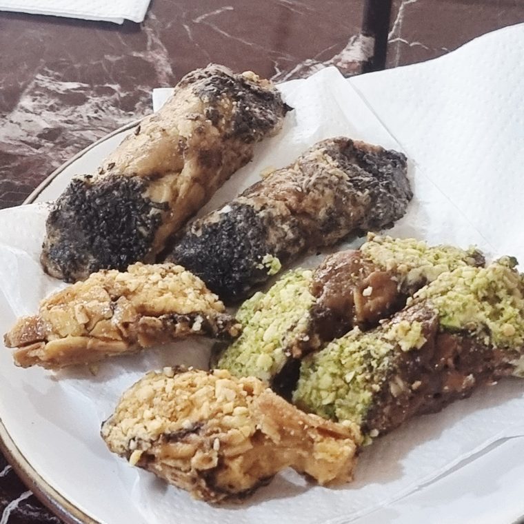Assorted filled pastries with pistachio and crushed nuts